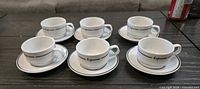 Full set of six cups and saucers displayed
