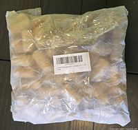 sealed bag of Tosnail natural cork wine corks with barcode label visible