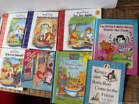 All eight books laid out showing covers