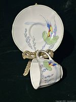 Cup displayed against saucer to show full pattern