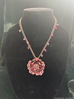 Full view of necklace on display bust showing double chain, bead accents, and pendant placement