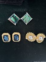 All three earring pairs laid out: abalone shell square, blue stone rectangular, faux pearl circular