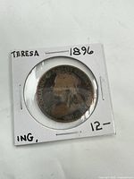 Obverse of coin in 2" cardboard flip showing Queen Victoria bust and handwritten 1896