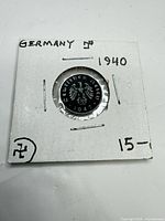 Coin in 2x2 cardboard holder, full view front and annotations