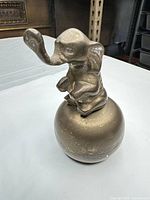 front view of elephant figurine bell showing overall form