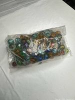 sealed plastic bag filled with multicolor marbles