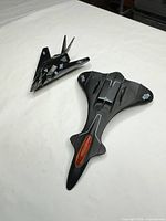 Top view of both black plastic toy jet airplanes with USAF decals
