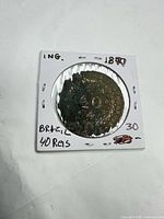 Obverse view of coin inside 2×2 flip