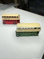 Overall view of both buses showing colours and size