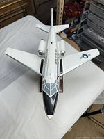 Top view showing overall aircraft shape, dual engines, wing markings, canopy detail