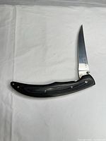 Full view of folded knife opened showing entire profile