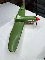 Top three-quarter view showing overall shape, shark mouth, propeller and US star insignia