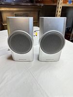 Front view of both silver Kenwood KS-358 speakers showing grilles and brand logos