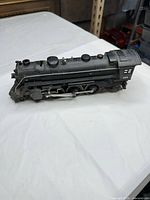 Left side view of complete locomotive showing cab number and running gear