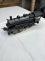 Left side view of Lionel 203 locomotive showing cab number and running gear