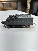 Side view showing Lionel Lines lettering and overall condition