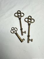 Three skeleton keys on white background, showing overall style and finish