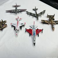six diecast airplanes arranged in two rows