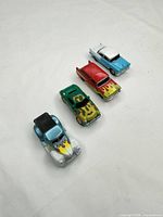 Four diecast cars in a row