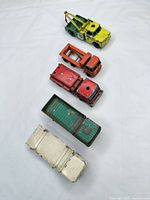 All five trucks lined up top view showing overall condition