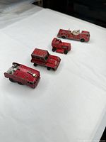 All four red Matchbox/Lesney fire vehicles lined up
