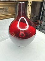Front view of red and white glass vase