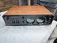 Front and top view showing wood veneer cabinet and overall layout