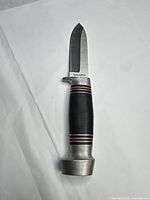 Full view of knife showing blade, handle and pommel