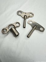 Overview of three vintage clock winding keys