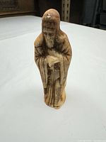Front view of beige plaster figurine