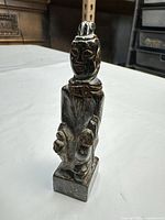 front view of soapstone figure standing on square base