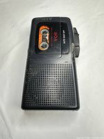 Front view showing cassette window, speaker grille and controls