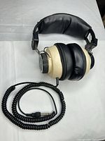 Full view of headphones with coiled cable and 1/4-inch plug