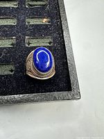 Front view showing lapis lazuli cabochon and silver detailing