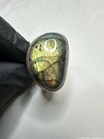 Ring profile showing labradorite flash and silver bezel