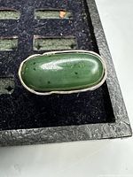 Top view showing green jade cabochon set in sterling silver