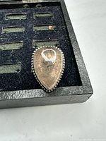 Front view of ring showing pear-shaped smoky quartz and beaded silver edge