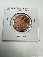 Obverse of Tibetan 1853 copper/bronze coin in 2×2 flip