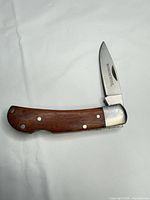 Knife fully open showing blade and handle