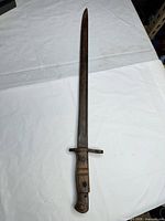 Full view of bayonet showing blade, guard, handle