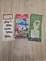 Front covers of three folded Ontario road maps by Supertest, Esso and Texaco