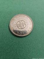 Reverse of 1964 commemorative dollar coin showing Charlottetown/Quebec design