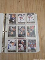 binder page with NHL Canvas insert cards featuring Buffalo Sabres, Montreal Canadiens, Ottawa Senators, Colorado Avalanche players