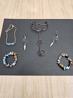 All jewellery items arranged on black background