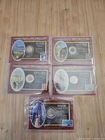 Overview of five packaged Canadian commemorative coins