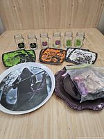 group shot of all mugs, plates, tray and decoration bag on table