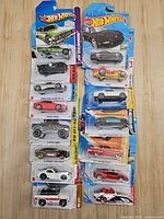 Overall view of both columns of 12 carded Hot Wheels cars
