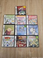 All eleven DS game cases arranged on tabletop showing cover art