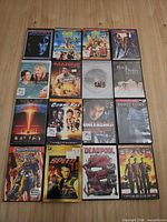 Full lot view showing all 16 DVD cases laid out