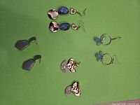 All four pairs displayed on green background